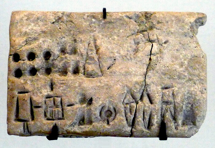 Ancient tablet with cuneiform script showcasing one of the world’s oldest written texts.