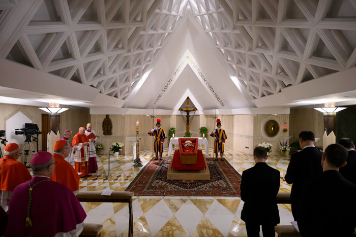 Pope Francis in open casket at Vatican, surrounded by clergy and Swiss Guards in chapel. Pope Francis in open casket at Vatican, surrounded by clergy and Swiss Guards in chapel.