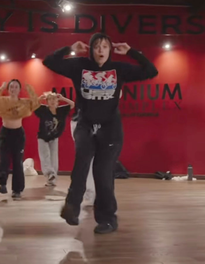 Dancer in a black hoodie performs in a studio, showcasing a stunning transformation and viral dance moves. Dancer in a black hoodie performs in a studio, showcasing a stunning transformation and viral dance moves.