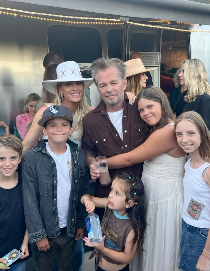 Group of people, including Teddi Mellencamp's dad, smiling together outdoors amidst cancer battle news. Group of people, including Teddi Mellencamp's dad, smiling together outdoors amidst cancer battle news.