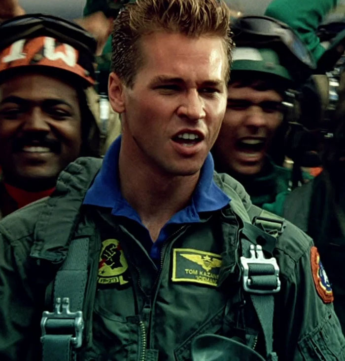 Actor in military gear portraying a pilot, capturing a tense scene. Actor in military gear portraying a pilot, capturing a tense scene.