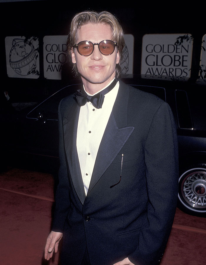 A man in a tuxedo with sunglasses at the Golden Globe Awards, embodying Batman star style. A man in a tuxedo with sunglasses at the Golden Globe Awards, embodying Batman star style.