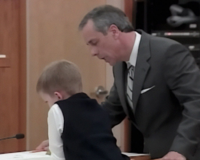Child in court with lawyer, related to son's silence after mom's life sentence. Child in court with lawyer, related to son's silence after mom's life sentence.
