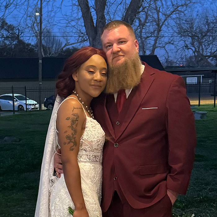 A couple embracing outdoors, highlighting racial disparity issues from viral video incident. A couple embracing outdoors, highlighting racial disparity issues from viral video incident.