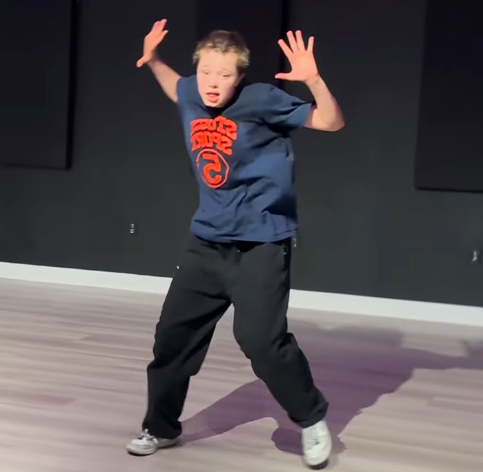Person in casual attire striking a dynamic pose indoors, highlighting a new look. Person in casual attire striking a dynamic pose indoors, highlighting a new look.