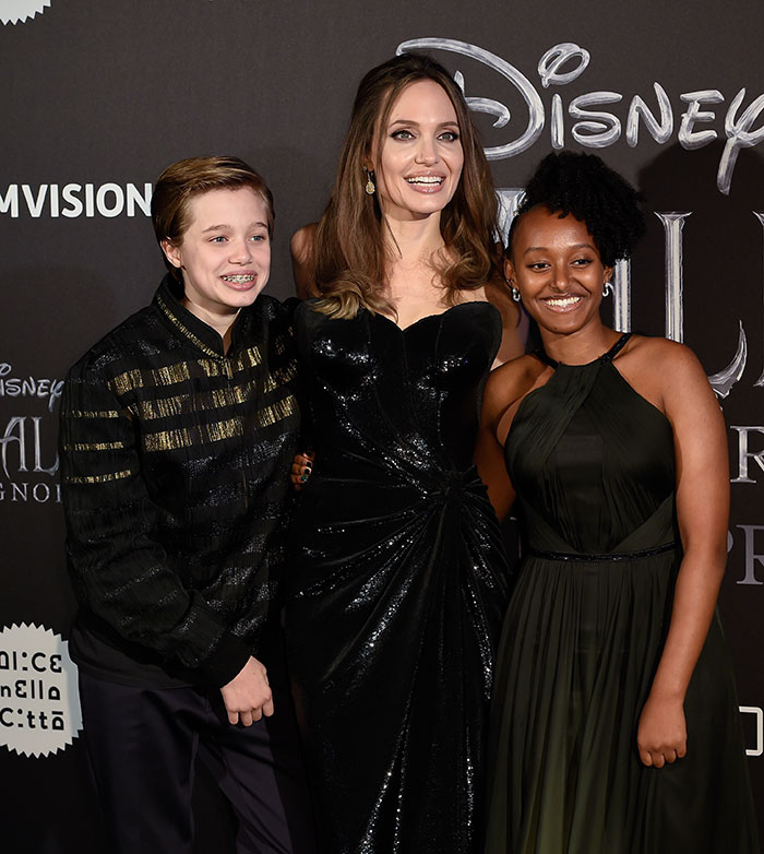 Angelina Jolie with her daughter Shiloh, showcasing a new look at a movie premiere event. Angelina Jolie with her daughter Shiloh, showcasing a new look at a movie premiere event.