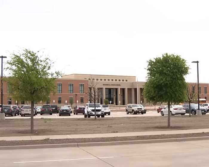 High school exterior with parked cars, related to Austin Metcalf conspiracy theory. High school exterior with parked cars, related to Austin Metcalf conspiracy theory.
