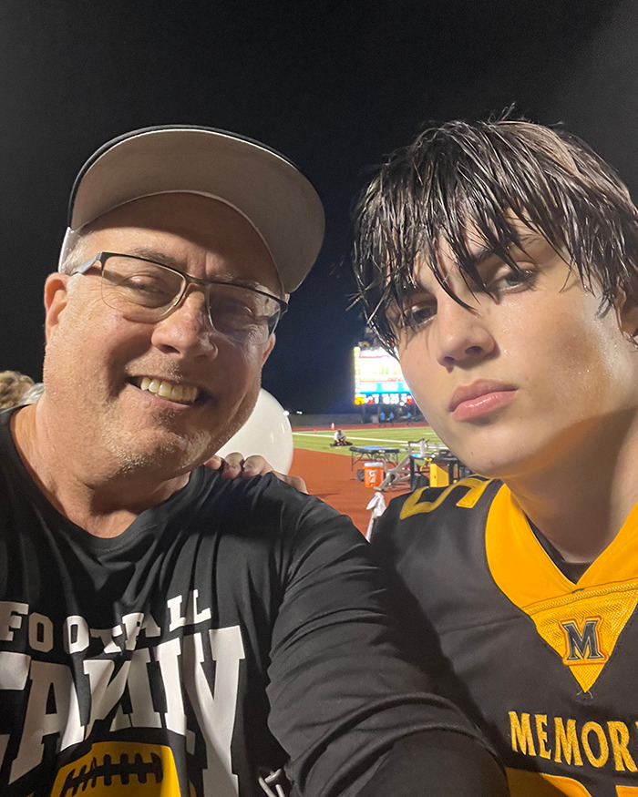 Two people pose for a photo on a football field, related to the Austin Metcalf conspiracy theory topic. Two people pose for a photo on a football field, related to the Austin Metcalf conspiracy theory topic.