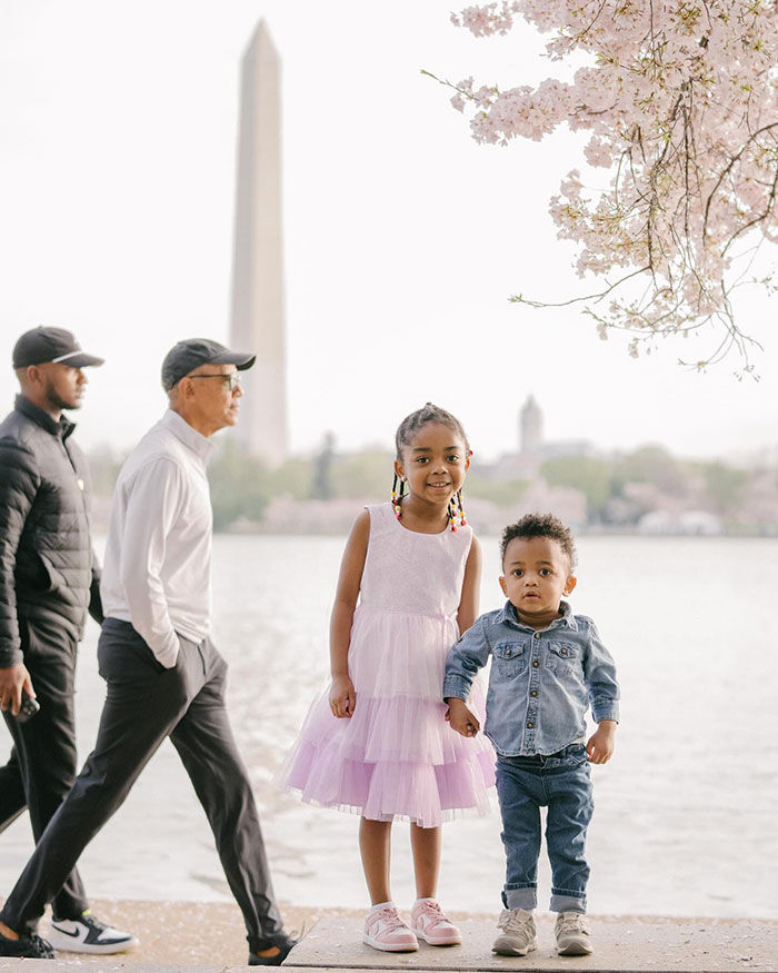 Barack Obama photobombs kids' photo shoot by a lake, with cherry blossoms and the Washington Monument in the background. Barack Obama photobombs kids' photo shoot by a lake, with cherry blossoms and the Washington Monument in the background.