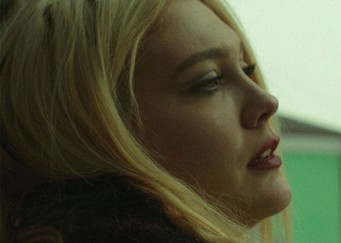 Woman looking thoughtful after being dumped, with soft lighting highlighting her profile. Woman looking thoughtful after being dumped, with soft lighting highlighting her profile.