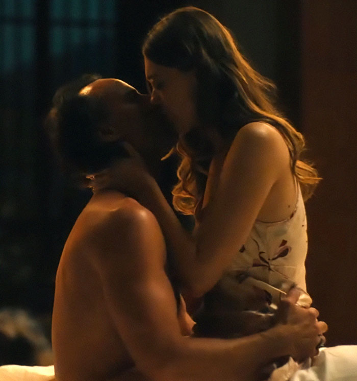 A couple intimately kissing in a dimly lit room, linked to Aimee Lou Wood's critique of a comedy skit. A couple intimately kissing in a dimly lit room, linked to Aimee Lou Wood's critique of a comedy skit.