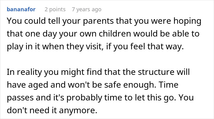 Sad daughter standing near a childhood tree house, reflecting on memories with a somber expression outdoors. Sad daughter standing near a childhood tree house, reflecting on memories with a somber expression outdoors.