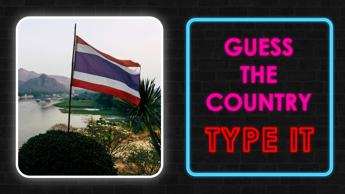 Flag of Thailand outdoors by a river with neon text sign saying guess the country and type it quiz clues game