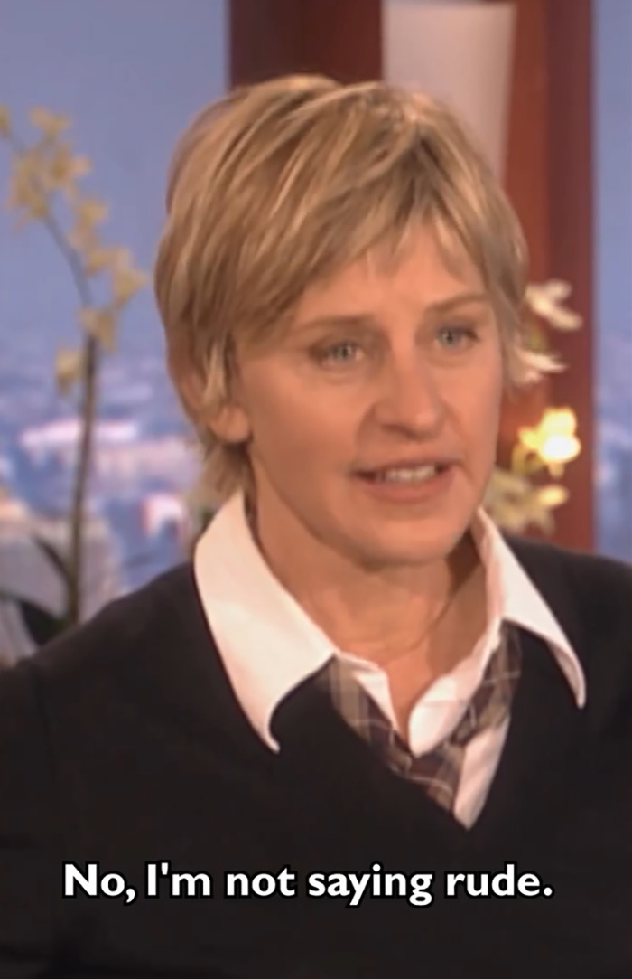 Ellen DeGeneres in a conversation, dressed in a black sweater over a collared shirt, discussing an awkward encounter. Ellen DeGeneres in a conversation, dressed in a black sweater over a collared shirt, discussing an awkward encounter.