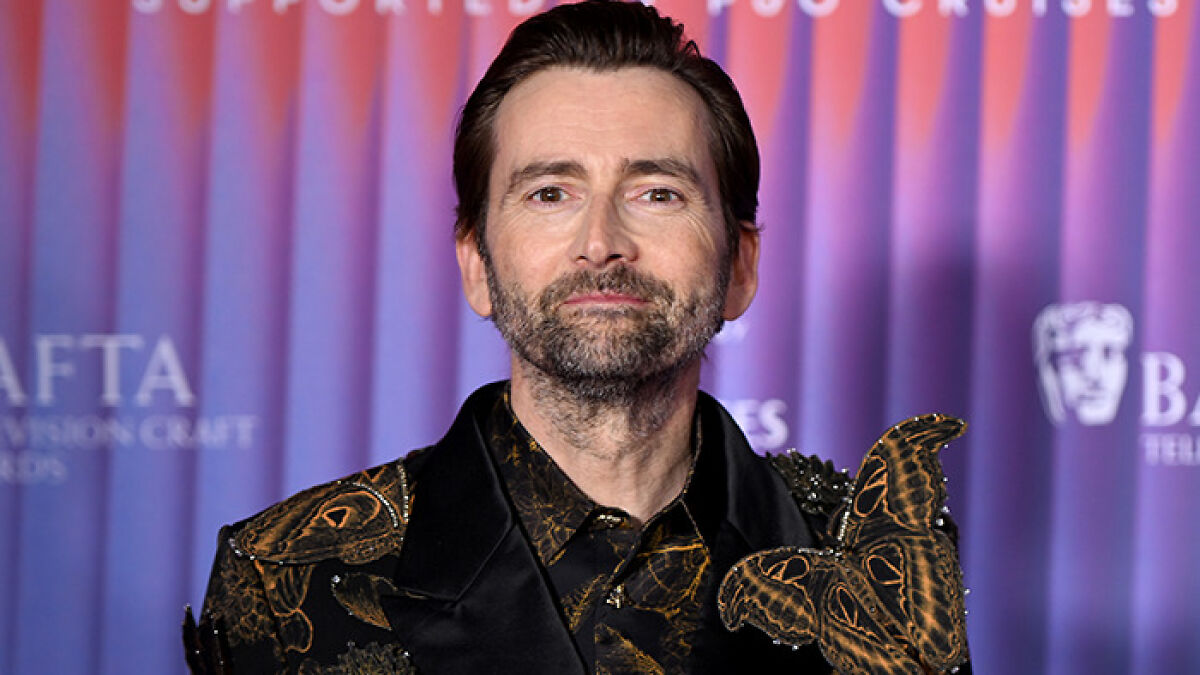 David Tennant posing at a BAFTA event, praised by fans for his gent in response to JK Rowling callout.