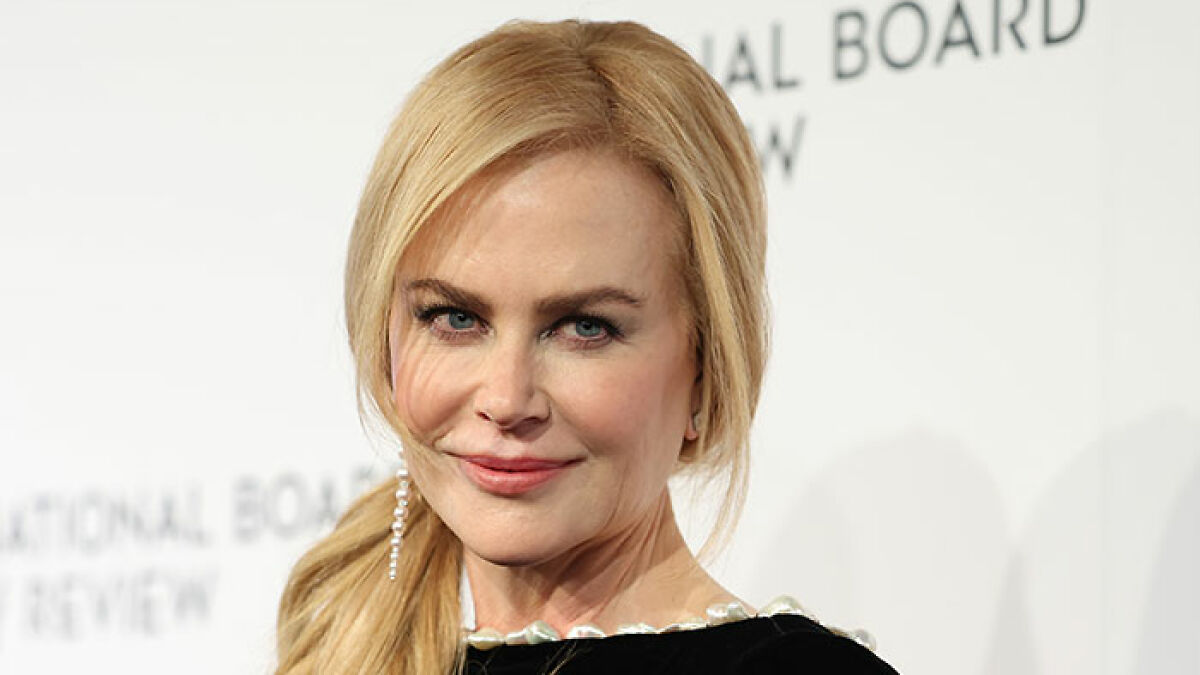Nicole Kidman, 57, posing at an event with blonde hair and subtle makeup, related to underwear dance controversy.