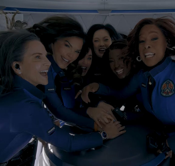 Group of people in blue flight suits humorously mimicking reactions to Katy Perry's Blue Origin flight in a satirical video. Group of people in blue flight suits humorously mimicking reactions to Katy Perry's Blue Origin flight in a satirical video.