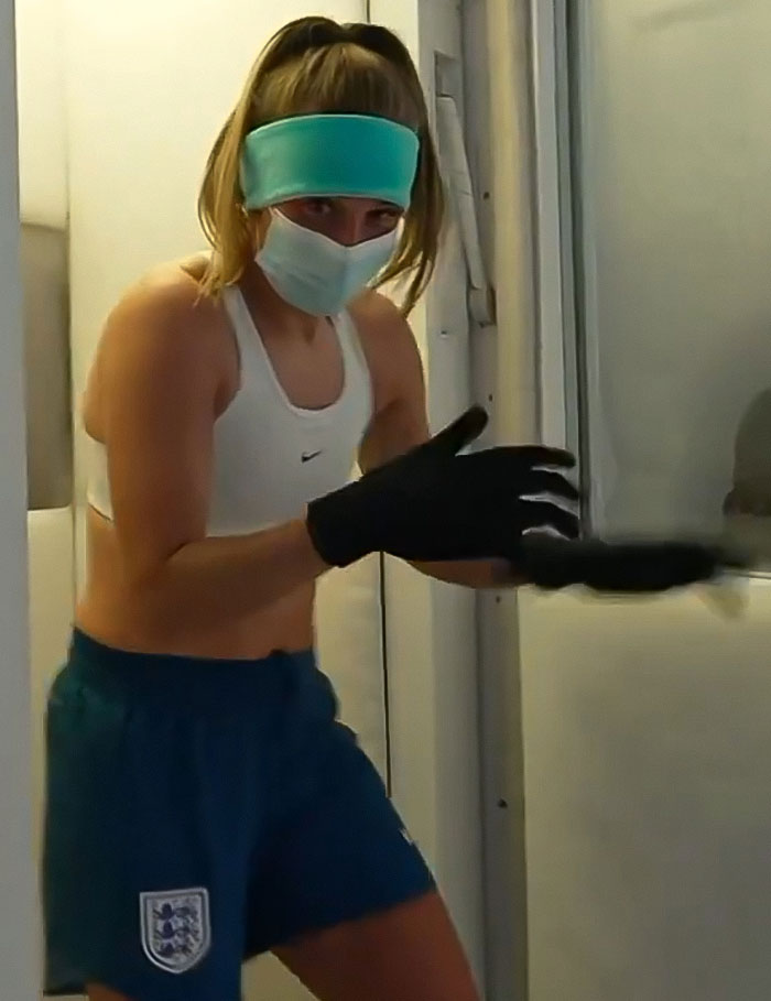 Woman in cryotherapy chamber wearing mask and gloves, highlighting treatment dangers. Woman in cryotherapy chamber wearing mask and gloves, highlighting treatment dangers.