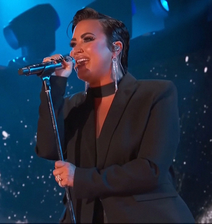 Singer performing on stage, sparking Ozempic accusations due to a notably slimmer appearance. Singer performing on stage, sparking Ozempic accusations due to a notably slimmer appearance.