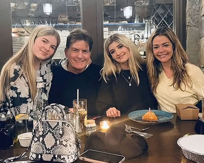 A family enjoying a meal together in a cozy restaurant setting. A family enjoying a meal together in a cozy restaurant setting.