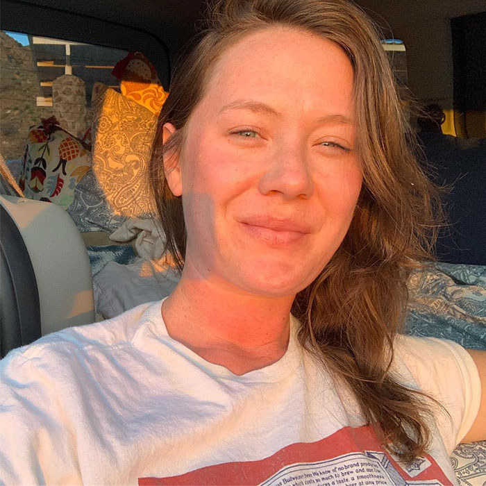 A woman in a white shirt sits in a sunlit space, connected to themes of confusion and deprivation. A woman in a white shirt sits in a sunlit space, connected to themes of confusion and deprivation.