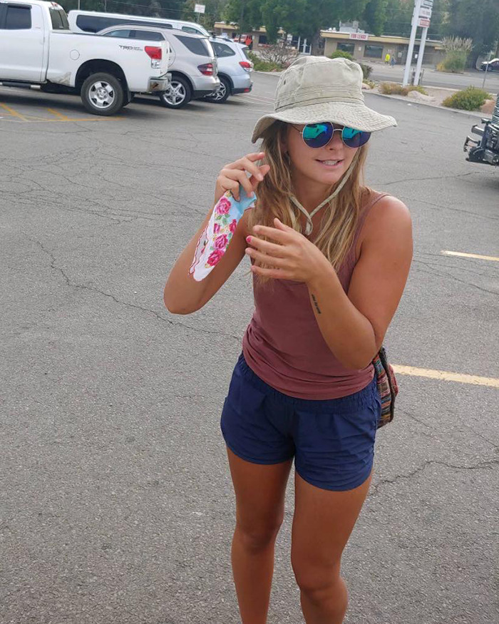 Young woman in casual wear with sunglasses and hat standing in a parking lot, recently found after going missing in Utah. Young woman in casual wear with sunglasses and hat standing in a parking lot, recently found after going missing in Utah.
