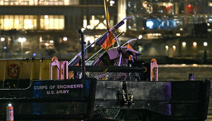Helicopter wreckage on a U.S. Army Corps of Engineers boat at night, possibly explaining the crash. Helicopter wreckage on a U.S. Army Corps of Engineers boat at night, possibly explaining the crash.