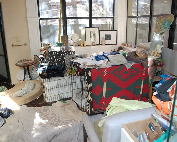 Messy room with colorful blanket and framed art, related to Gene Hackman's notes found. Messy room with colorful blanket and framed art, related to Gene Hackman's notes found.