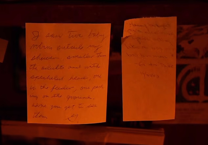 Handwritten notes to Betsy from Gene Hackman, displayed on a dark surface. Handwritten notes to Betsy from Gene Hackman, displayed on a dark surface.
