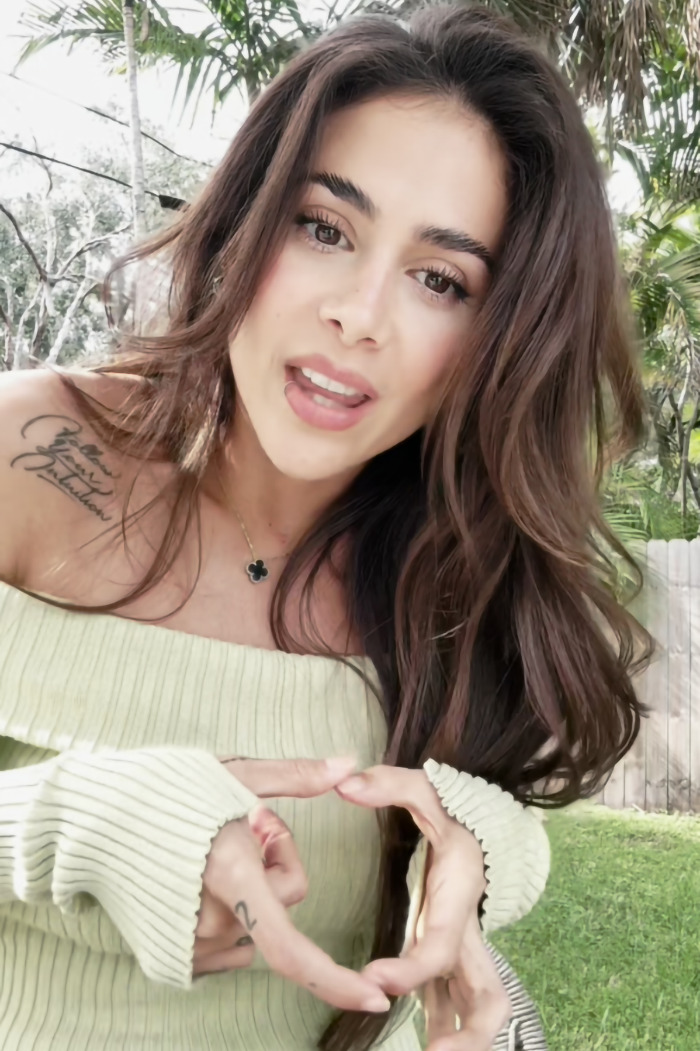 Singer Greeicy in a garden, discussing her experience with a "husband stitch" after childbirth. Singer Greeicy in a garden, discussing her experience with a "husband stitch" after childbirth.