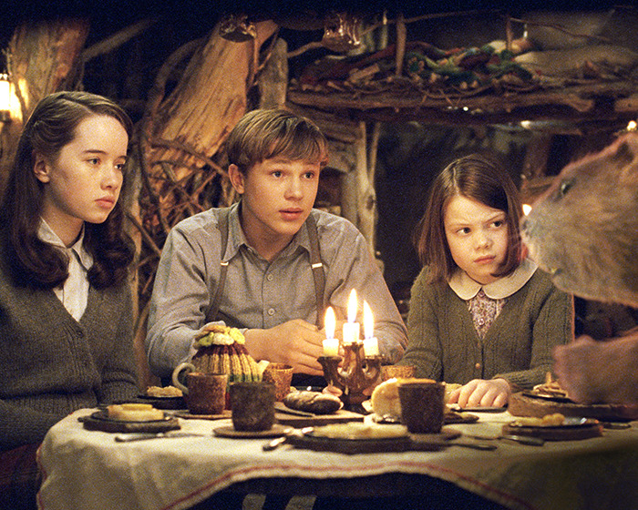 Children from the 'Narnia' reboot sitting at a table with lit candles and food, sparking gender swap rumors. Children from the 'Narnia' reboot sitting at a table with lit candles and food, sparking gender swap rumors.