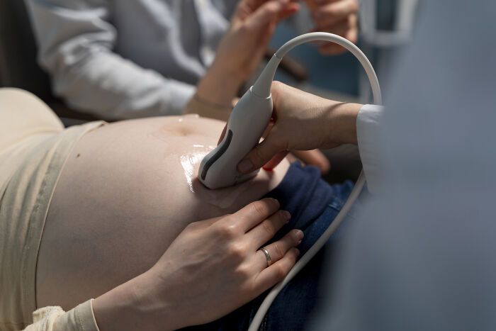 Person getting an ultrasound, highlighting skill in a medical setting.