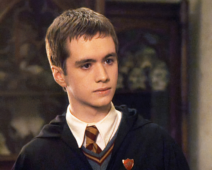 Young actor in Gryffindor attire from Harry Potter, expressing opinions on JK Rowling's trans ruling celebration. Young actor in Gryffindor attire from Harry Potter, expressing opinions on JK Rowling's trans ruling celebration.