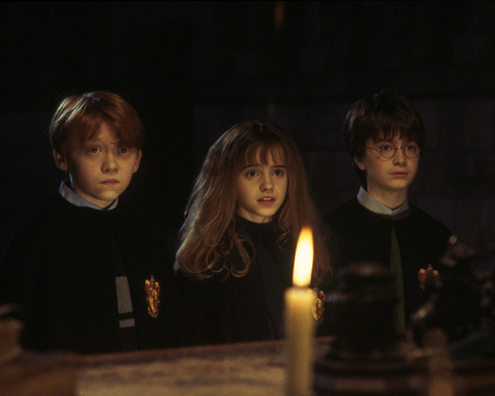 Harry Potter actors in a dimly lit scene, capturing a tense moment related to JK Rowling's controversy. Harry Potter actors in a dimly lit scene, capturing a tense moment related to JK Rowling's controversy.