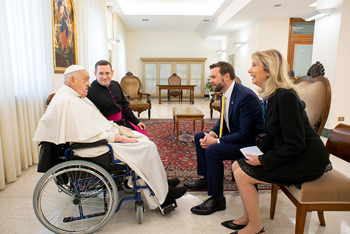 JD Vance meeting Pope Francis in a formal room, engaging in a seated conversation with others present. JD Vance meeting Pope Francis in a formal room, engaging in a seated conversation with others present.