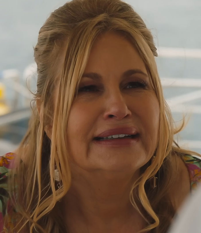 A woman in a floral top responds emotionally to a question, highlighting her connection with LGBTQ+ fans. A woman in a floral top responds emotionally to a question, highlighting her connection with LGBTQ+ fans.