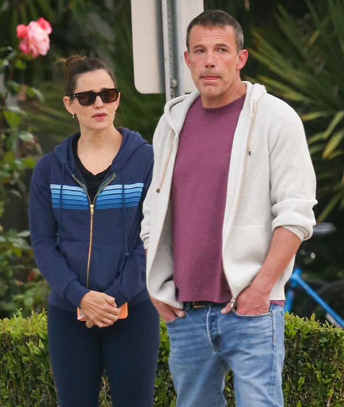 Two people standing outdoors, the woman in sunglasses and a blue hoodie. Keyword: Animal Cruelty. Two people standing outdoors, the woman in sunglasses and a blue hoodie. Keyword: Animal Cruelty.
