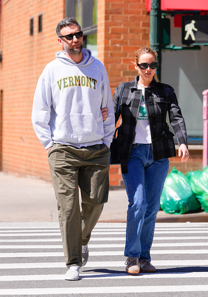 A couple walks arm in arm on a city street; main keywords: Jennifer Lawrence, Cooke Maroney. A couple walks arm in arm on a city street; main keywords: Jennifer Lawrence, Cooke Maroney.