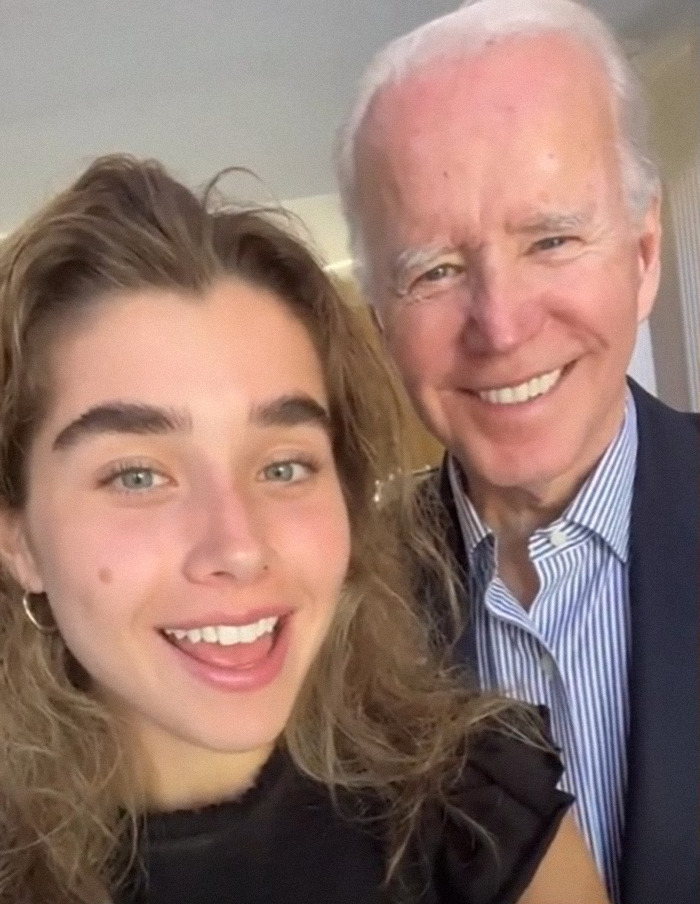 Joe Biden smiles with a young woman, creating buzz online over his Easter family photo. Joe Biden smiles with a young woman, creating buzz online over his Easter family photo.