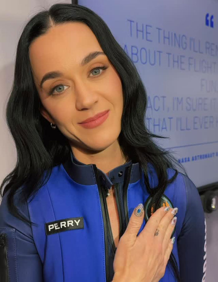 Singer in a blue outfit, hand on chest, showing support amid recent mockery in media. Singer in a blue outfit, hand on chest, showing support amid recent mockery in media.
