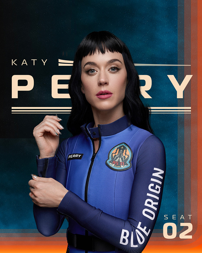 Katy Perry in Blue Origin suit, posing confidently against a branded background. Katy Perry in Blue Origin suit, posing confidently against a branded background.