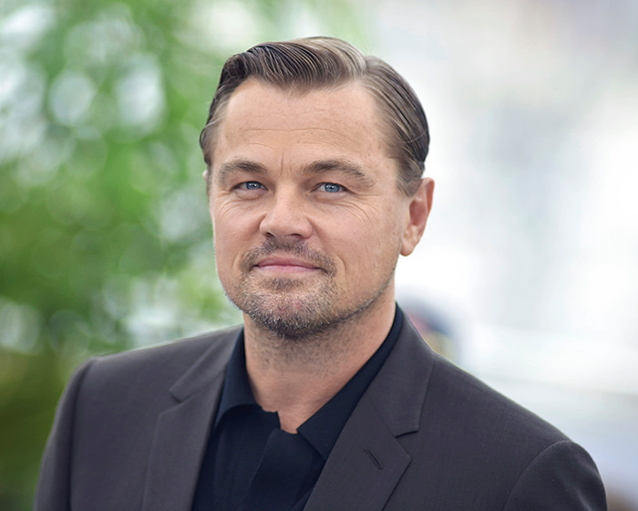 Man in a suit on a red carpet, showcasing a midlife crisis-inspired look. Man in a suit on a red carpet, showcasing a midlife crisis-inspired look.