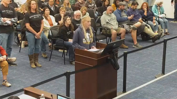 A girl gives testimony on a trans locker room issue at a board meeting, sparking a strong reaction. A girl gives testimony on a trans locker room issue at a board meeting, sparking a strong reaction.