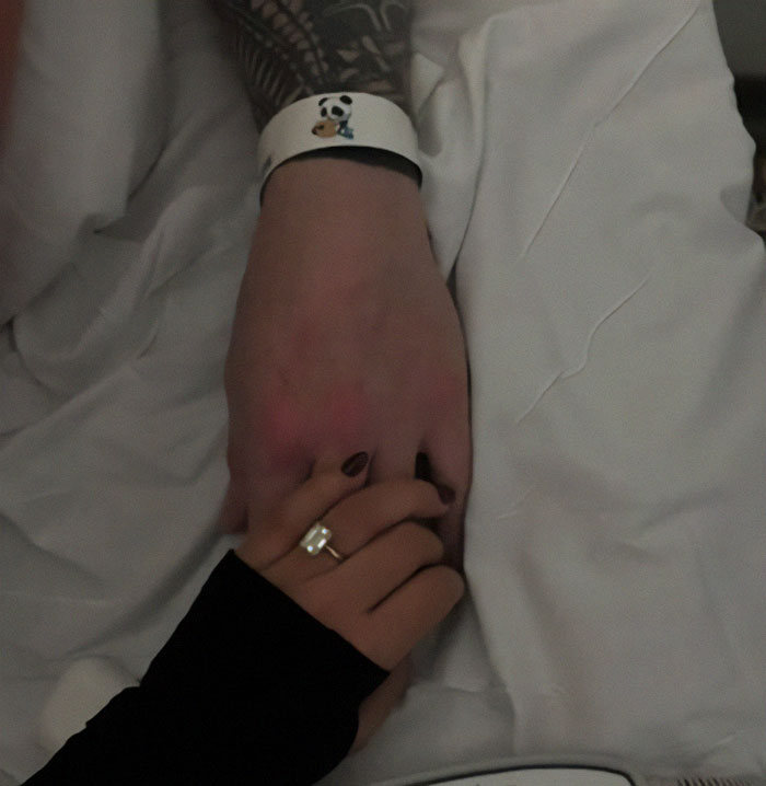 Hands holding in a touching moment, symbolizing love and mystery surrounding burial location. Hands holding in a touching moment, symbolizing love and mystery surrounding burial location.