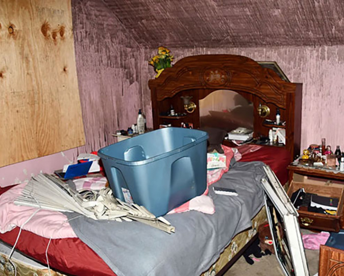 Cluttered bedroom scene related to man held captive by stepmom for 20 years. Cluttered bedroom scene related to man held captive by stepmom for 20 years.
