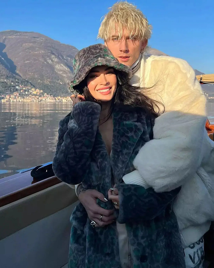 Couple embracing on a boat, with mountains in the background, related to baby name confusion topic. Couple embracing on a boat, with mountains in the background, related to baby name confusion topic.