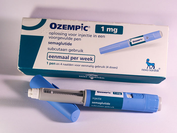 Ozempic pen and packaging, highlighting potential "Ozempic Feet" side effect warned by experts. Ozempic pen and packaging, highlighting potential "Ozempic Feet" side effect warned by experts.