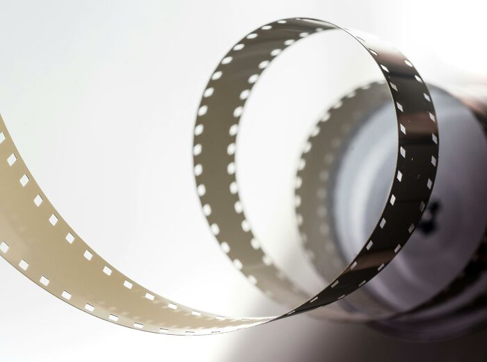 A rolled strip of film representing iconic movie moments. A rolled strip of film representing iconic movie moments.