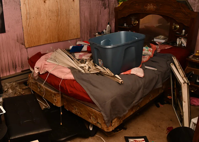 Disturbing room scene with cluttered bed and damaged items in a horror house. Disturbing room scene with cluttered bed and damaged items in a horror house.