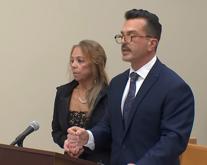 Man and woman at a podium, related to disturbing horror house case discovery. Man and woman at a podium, related to disturbing horror house case discovery.